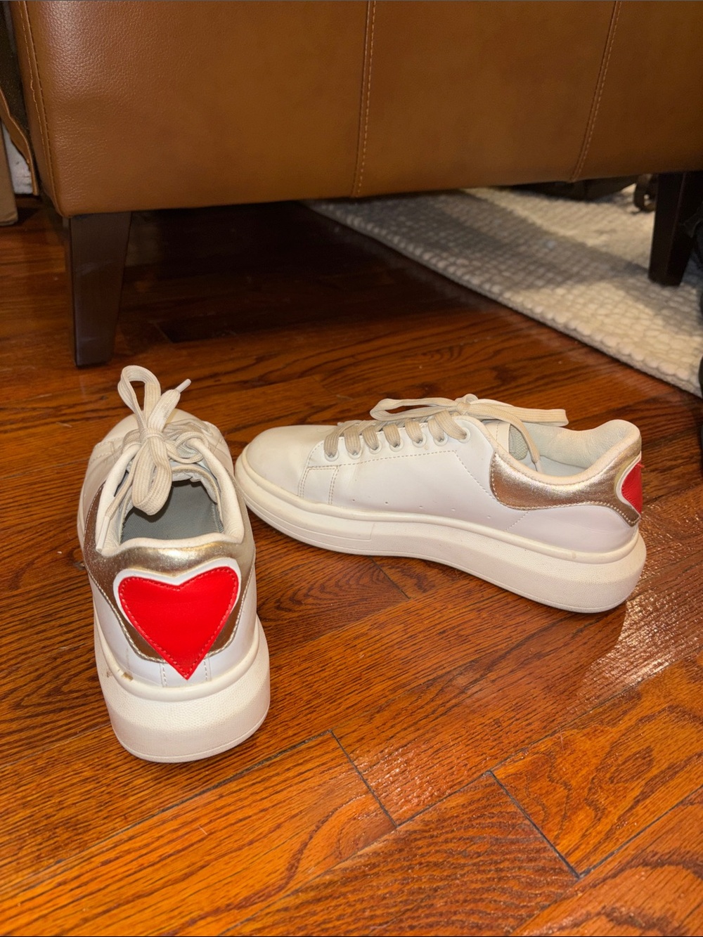 White Platform Sneakers with Red Heel Accent and Gold Trim